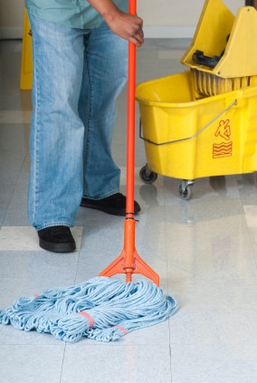 Cleanup Man janitor in Kingsburg, CA mopping floor.